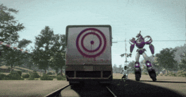 a robot standing in front of a target truck