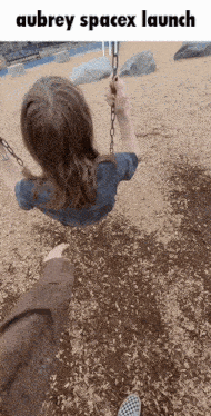 a girl is swinging on a swing with the words aubrey spacex launch written above her