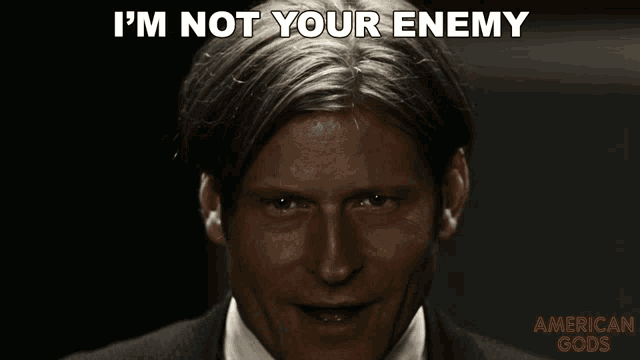 a close up of a man 's face with the words i 'm not your enemy above him