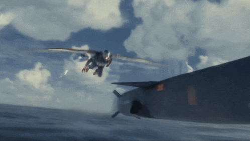 a fighter jet is flying over a body of water with a red sticker on the side that says ' us navy '