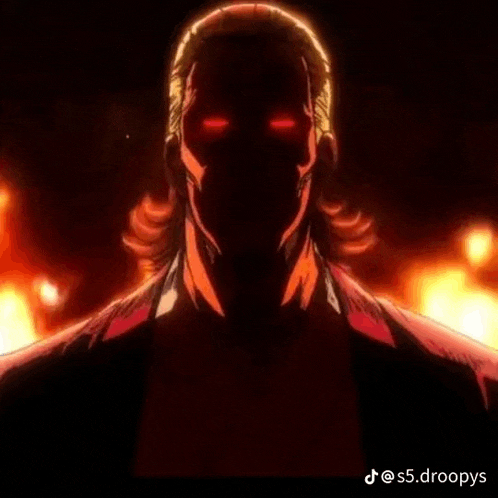 a close up of a man 's face with red eyes in a dark room .