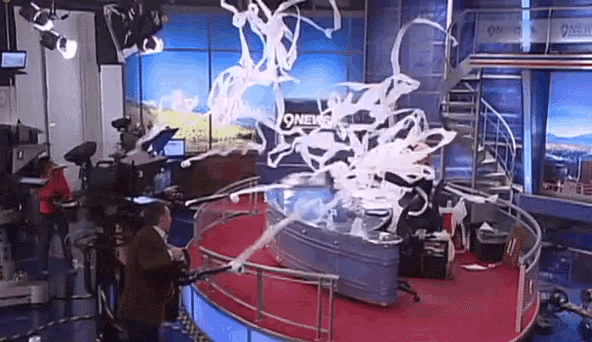 a news studio with a sign that says 9news