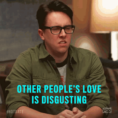 a man wearing glasses and a green shirt says other people 's love is disgusting in blue letters