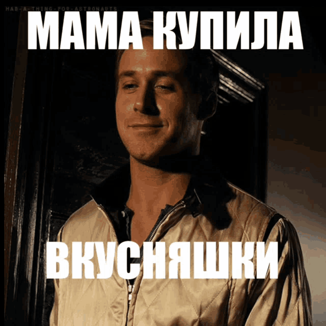a man wearing a quilted jacket is smiling in front of a sign that says " mama kupila "