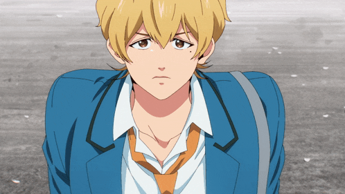 a close up of a person wearing a blue jacket and tie