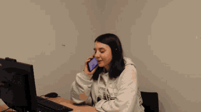 a person wearing headphones and a blue sweatshirt with the name andrey beilharz on it