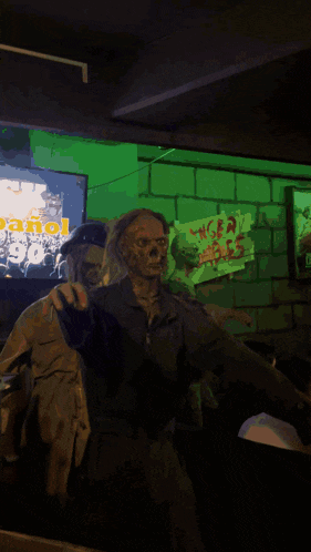a statue of a zombie wearing a goggles and holding a yellow sign with a hand on it