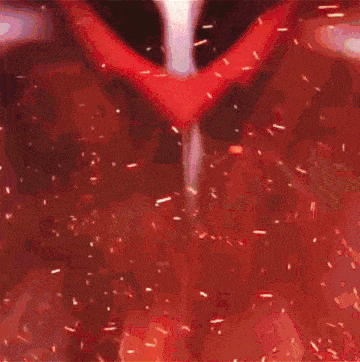 a close up of a person 's face with red and black