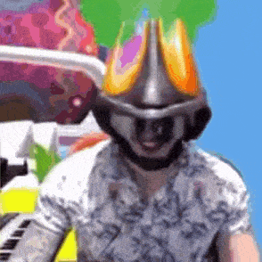 a man wearing a helmet and headphones is playing a keyboard .