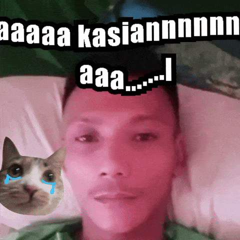 a man laying in bed with a cat behind him with tears in its eyes and the words aaa kasiannnn aaa