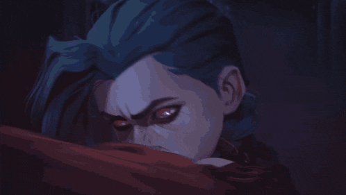 a close up of a person 's face with a blue light coming from it .
