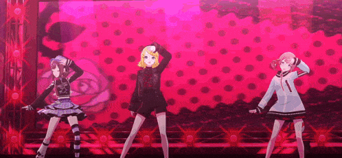 three anime girls are dancing on a stage in front of a pink polka dot background