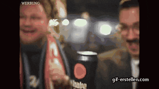 a man is holding a can of coca cola
