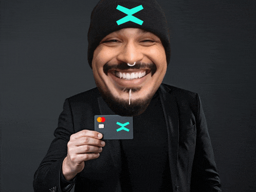 a man wearing a hat with the letter x on it