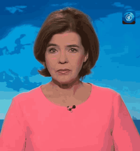 a woman in a pink shirt with the word smash on it