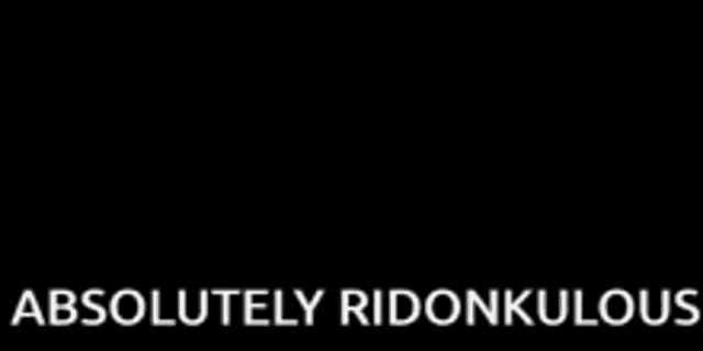three pigeons are standing next to each other in front of a fence with the words `` absolutely ridonkulous '' .