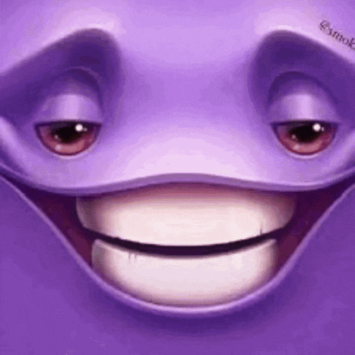 a close up of a purple cartoon character 's face with a smiling face .