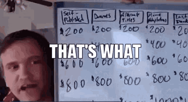 a man is standing in front of a whiteboard with the words `` that 's what '' on it .