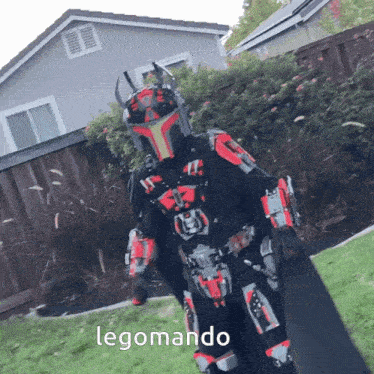 a person in a lego costume is standing in front of a building