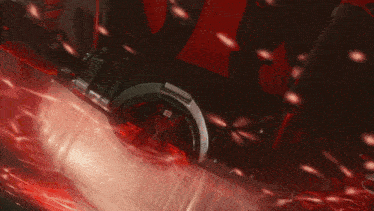 a close up of a person 's hand in a red light