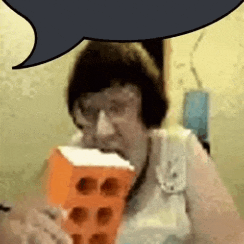 a woman is eating a brick and talking with a speech bubble behind her .