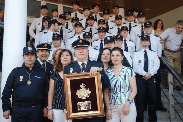 a group of police officers pose for a picture