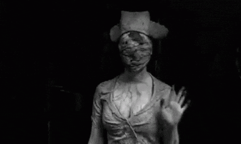a black and white photo of a nurse with a mask on her face waving her hand .