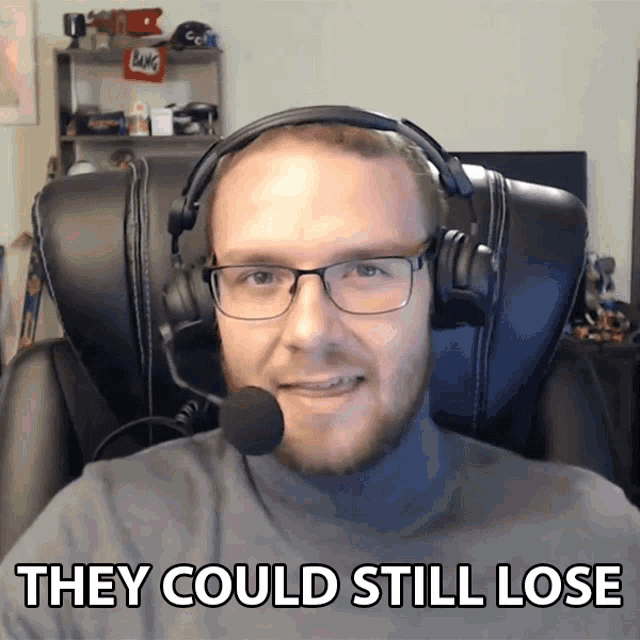 a man wearing glasses and headphones says " they could still lose "