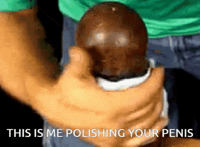 a close up of a person polishing a penis with the words this is me polishing your penis