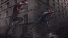 two superheros are fighting in front of a building with the words be greater together written below them