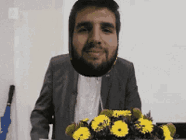 a man with a beard is holding a bouquet of flowers