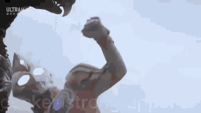 a man is fighting a monster with horns in the sky .