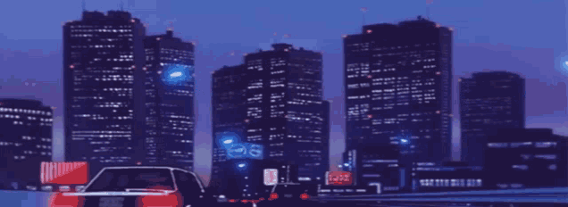 a car is driving down a highway with a city in the background