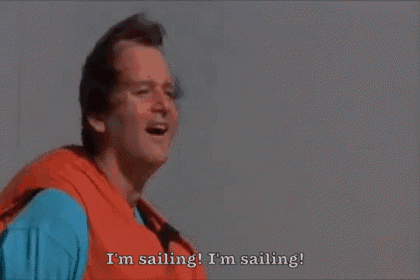 a man in a life vest is saying i 'm sailing i 'm sailing !