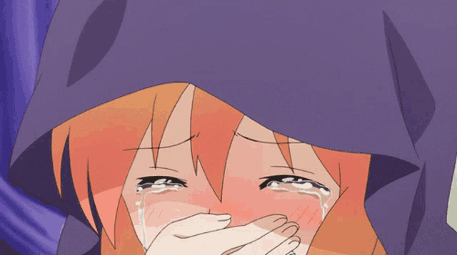 a girl with orange hair is crying and covering her face with her hands