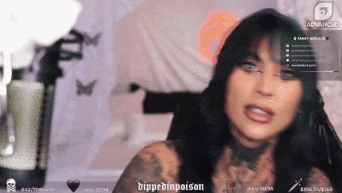 a woman with a tattoo on her chest is talking on a twitch channel called dippedinpoison