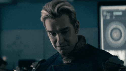 a close up of a man 's face in a dark room with a circle in the background