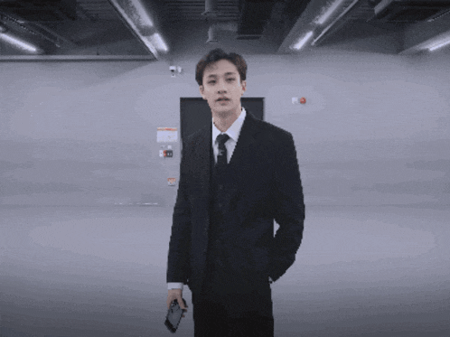 a man in a suit and tie is standing in a room with the words whoa bitch you really did it below him