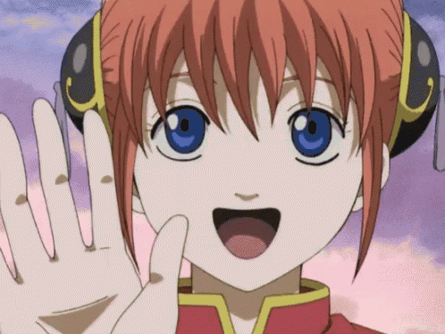 a girl with red hair and blue eyes is waving