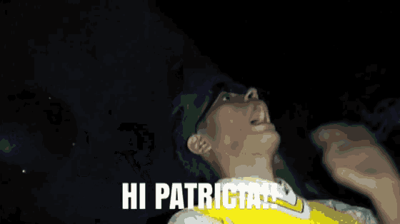 a man in a yellow shirt is looking up at the sky and says you still look like a slut