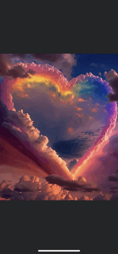 a heart shaped cloud with a rainbow behind it