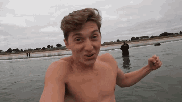 a man without a shirt is in the water