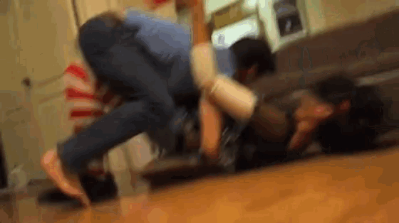 a blurry picture of a man laying on the floor