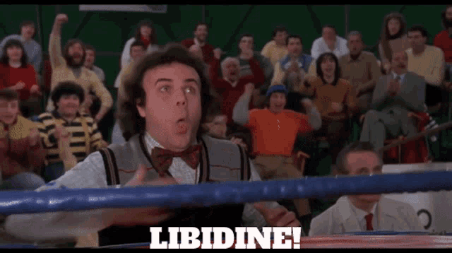 a man in a boxing ring with the word libidine on the bottom