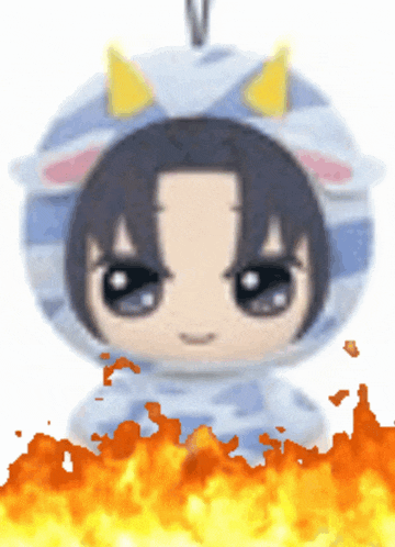 a stuffed animal with horns on it is surrounded by fire