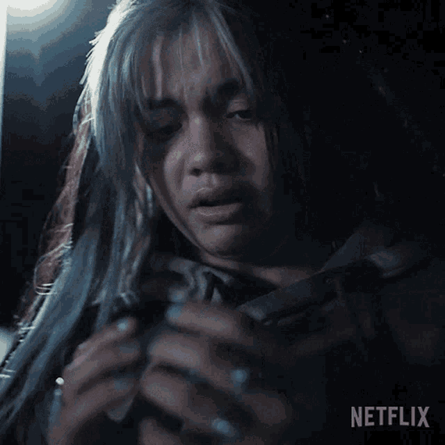 a netflix advertisement with a woman crying and the words it 's happening above her