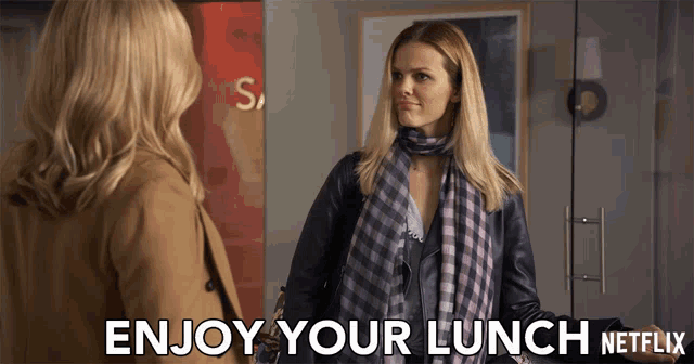 two women standing next to each other with the words enjoy your lunch netflix on the bottom