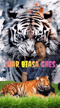a man poses with a tiger in front of a poster that says luar biasa caes