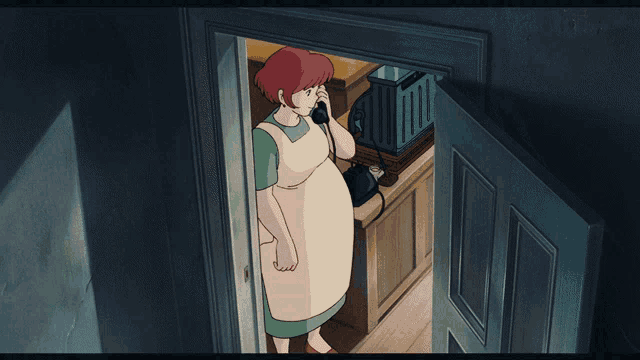 a woman in an apron is talking on a phone