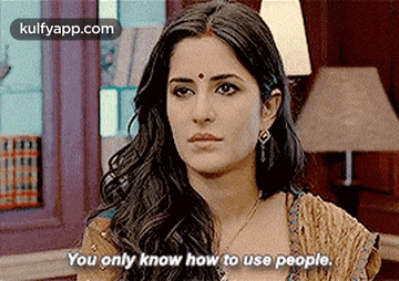 a woman is talking about how to use people in a room .